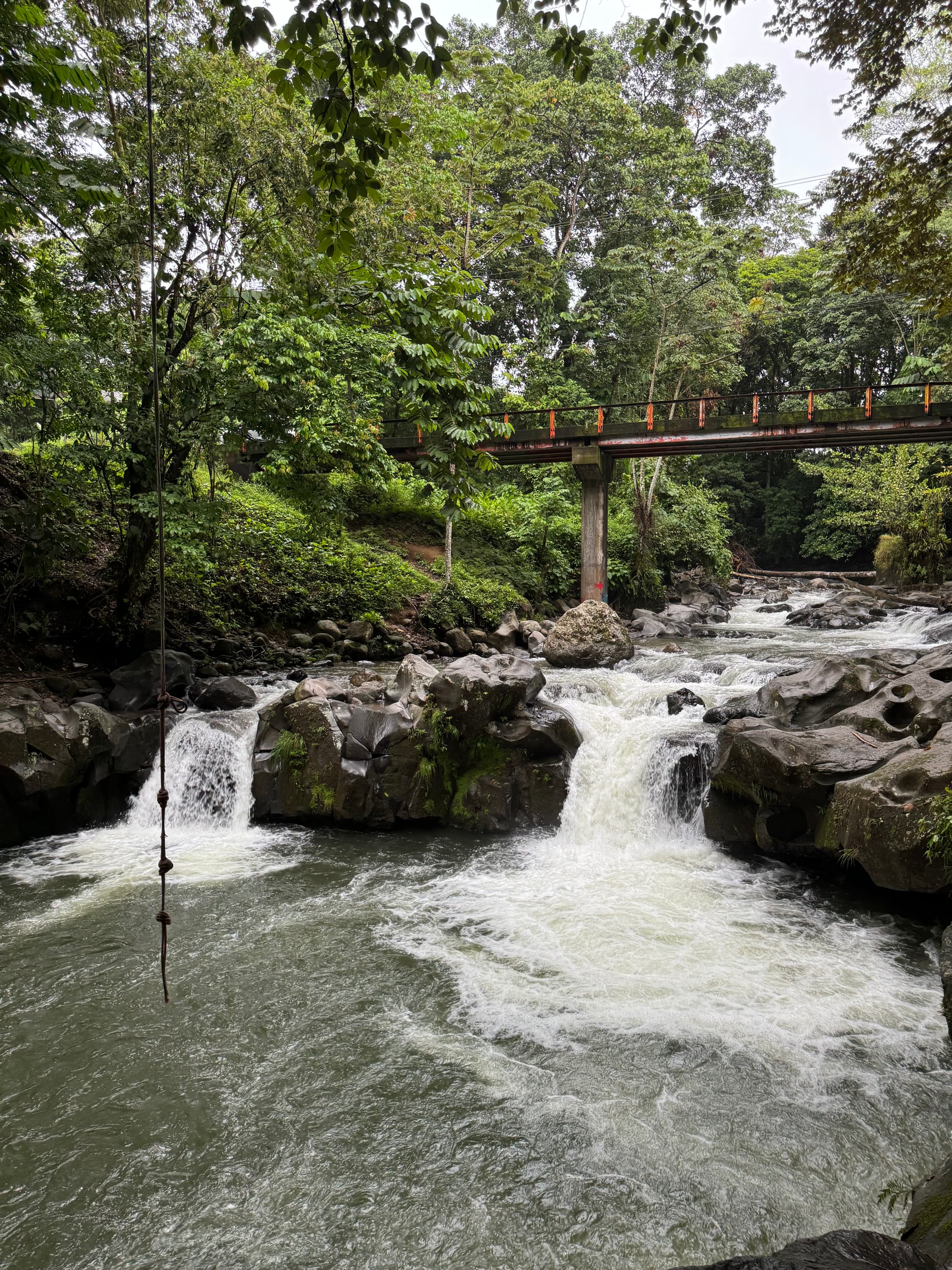 Rope swing in La Fortuna. Place is known as El Salto. Two waterfalls with swimming hole.